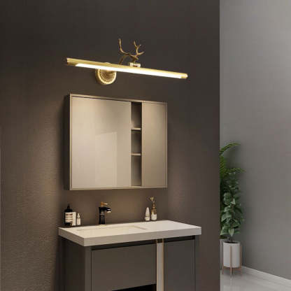 Brass staghorn vanity light on bathroom wall
