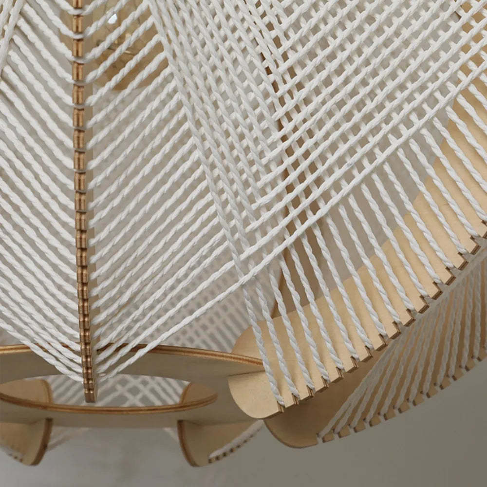 Close-up of Muto pendant light: white rope and wood details