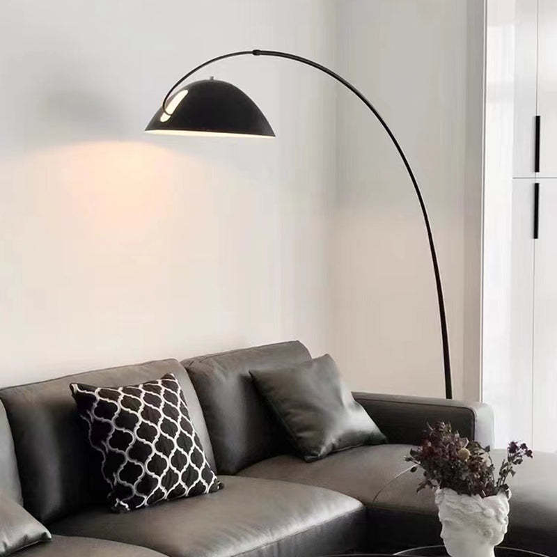 Modern black Avi floor lamp over gray couch | Las Sola