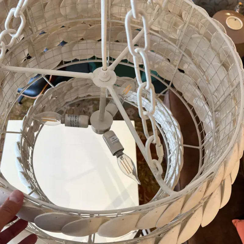 Morandi pendant light detail, showing bulbs, chain and disc design.