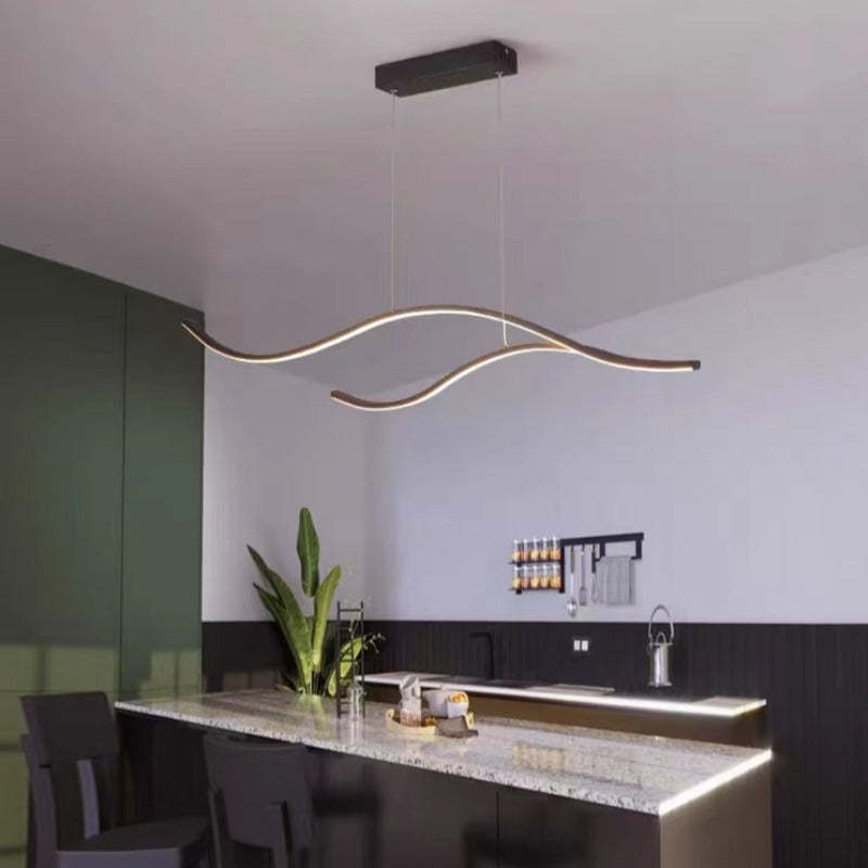 Modern curved pendant light in kitchen, Las Sola lighting.