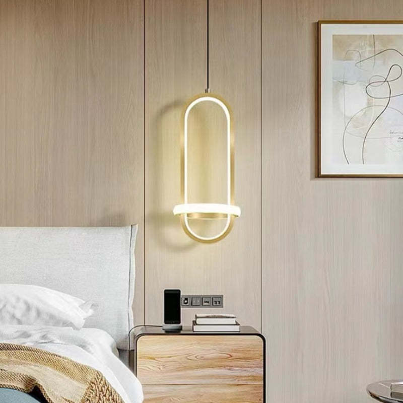 Nyla LED ring pendant light over a bedroom nightstand