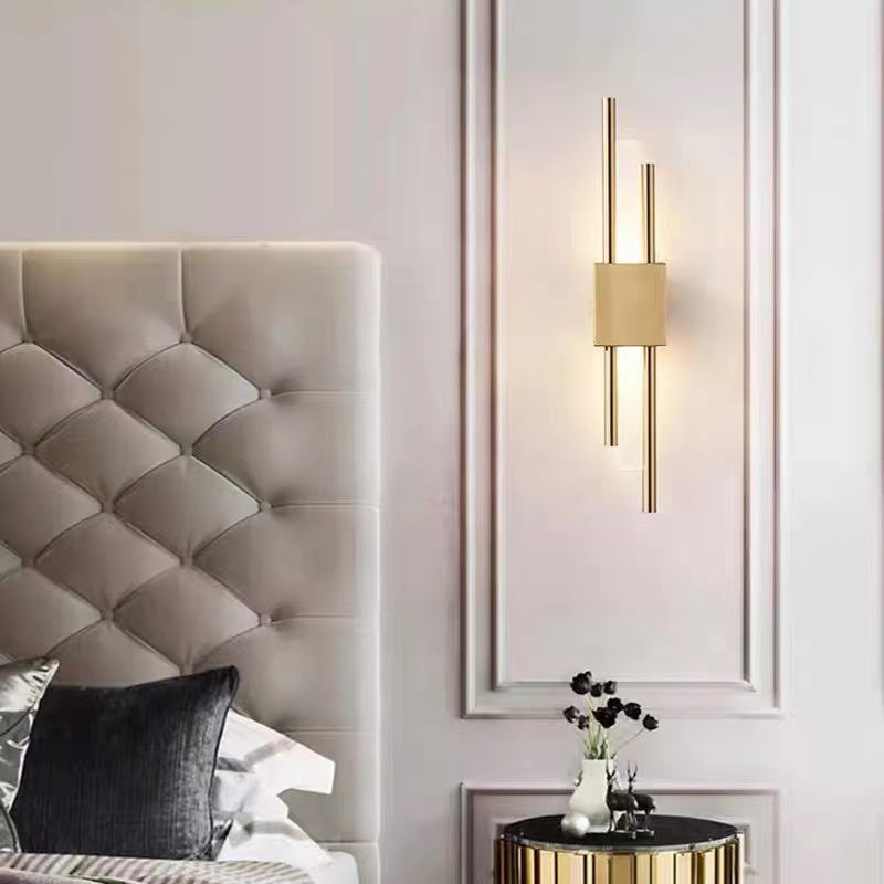 Alana modern LED wall lamp in bedroom. Metal and marble lighting.