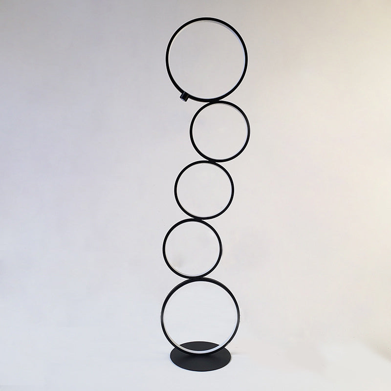 Black Arisha multi-ring floor lamp. Modern metal lighting.