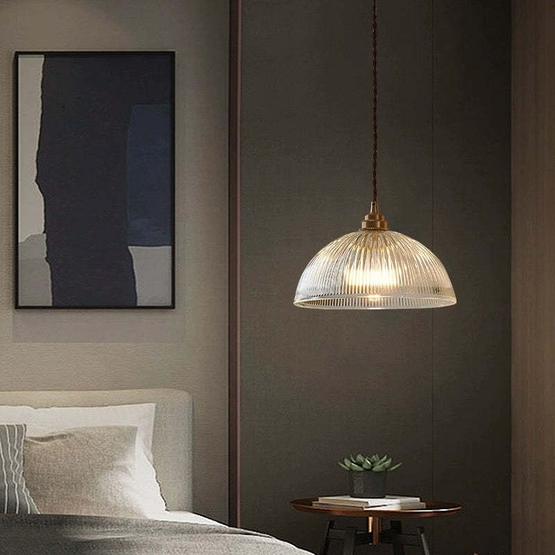 Alessio glass pendant light above bed