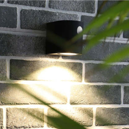 Orr modern square outdoor wall lamp on brick wall.
