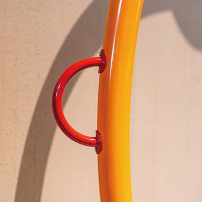 Close-up: Morandi floor lamp with red handle detail.