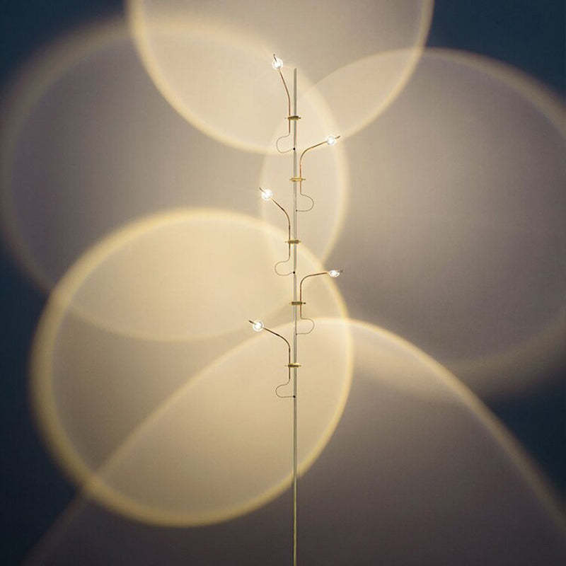 Salgado floor lamp projecting warm light circles