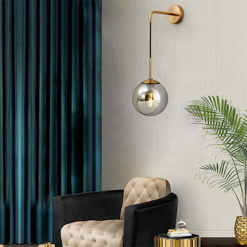 Modern LED wall lamp with glass globe in living room.