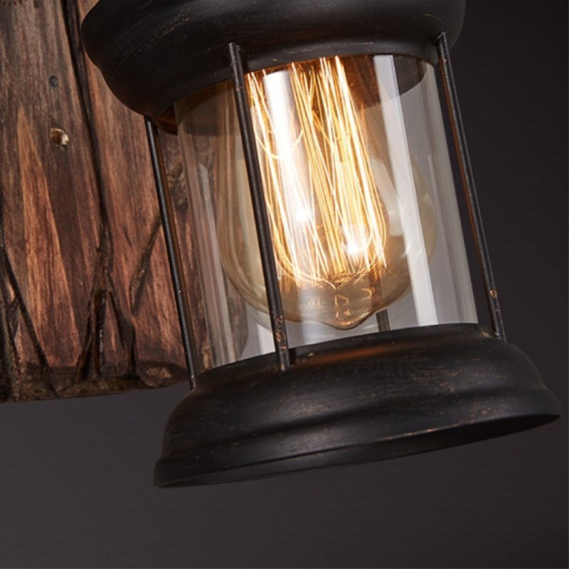 Vintage bronze metal lantern wall lamp on wood base. Alessio lighting.