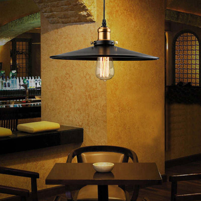 Alessio pendant light. Modern industrial lighting above dining table.