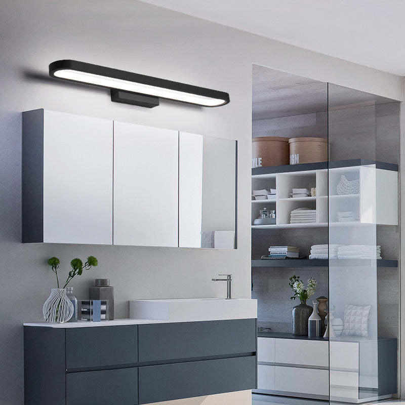 Leigh metal wall lamp in modern bathroom setting.