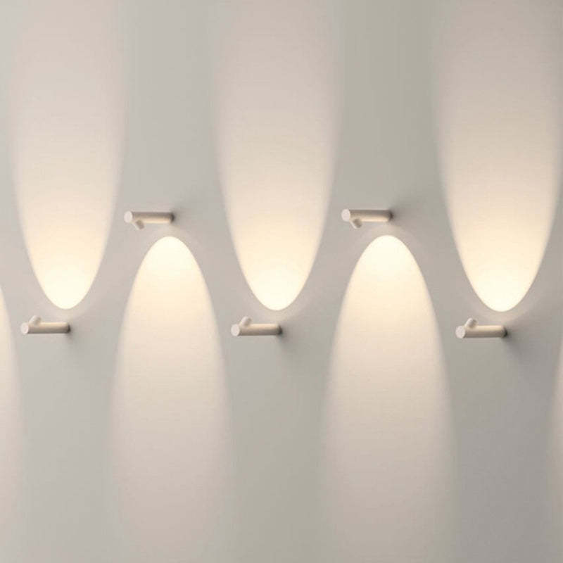 Orr Modern Outdoor Wall Lamps illuminating a wall