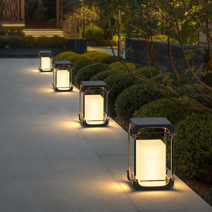 Las Sola Orr outdoor floor lamps illuminate garden path.