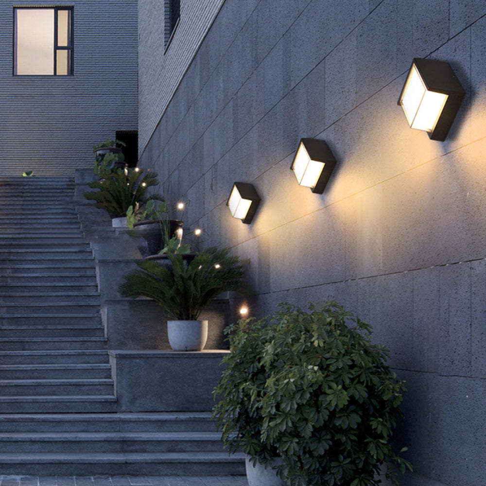 Modern outdoor wall lamps illuminating a garden staircase