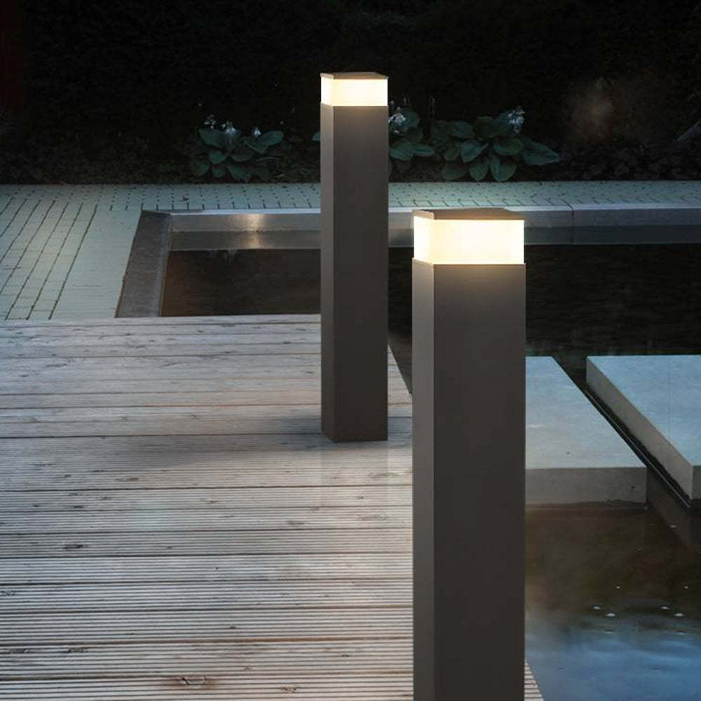 Orr Modern Path Light illuminating wooden deck at night
