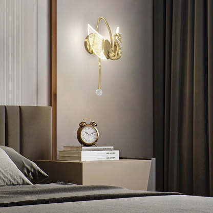 Swan-shaped wall lamp in bedroom setting