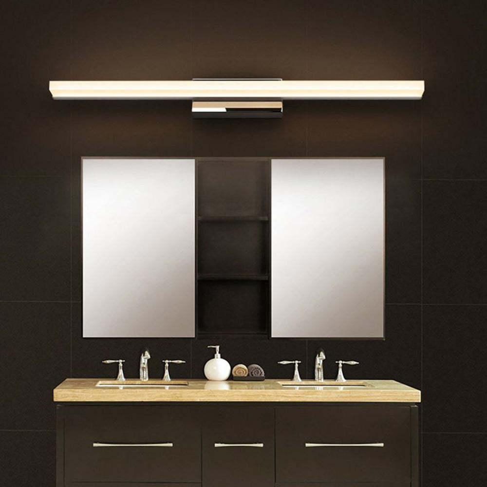 Leigh LED vanity light over dark brown vanity.