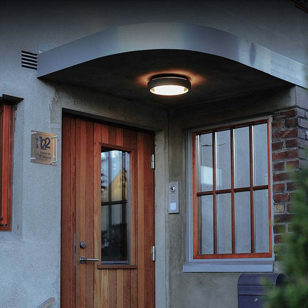 Orr Outdoor Wall Lamp illuminates building entrance