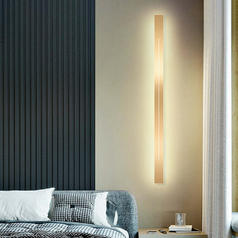 Modern gold LED wall lamp in bedroom, Lassola lighting solution