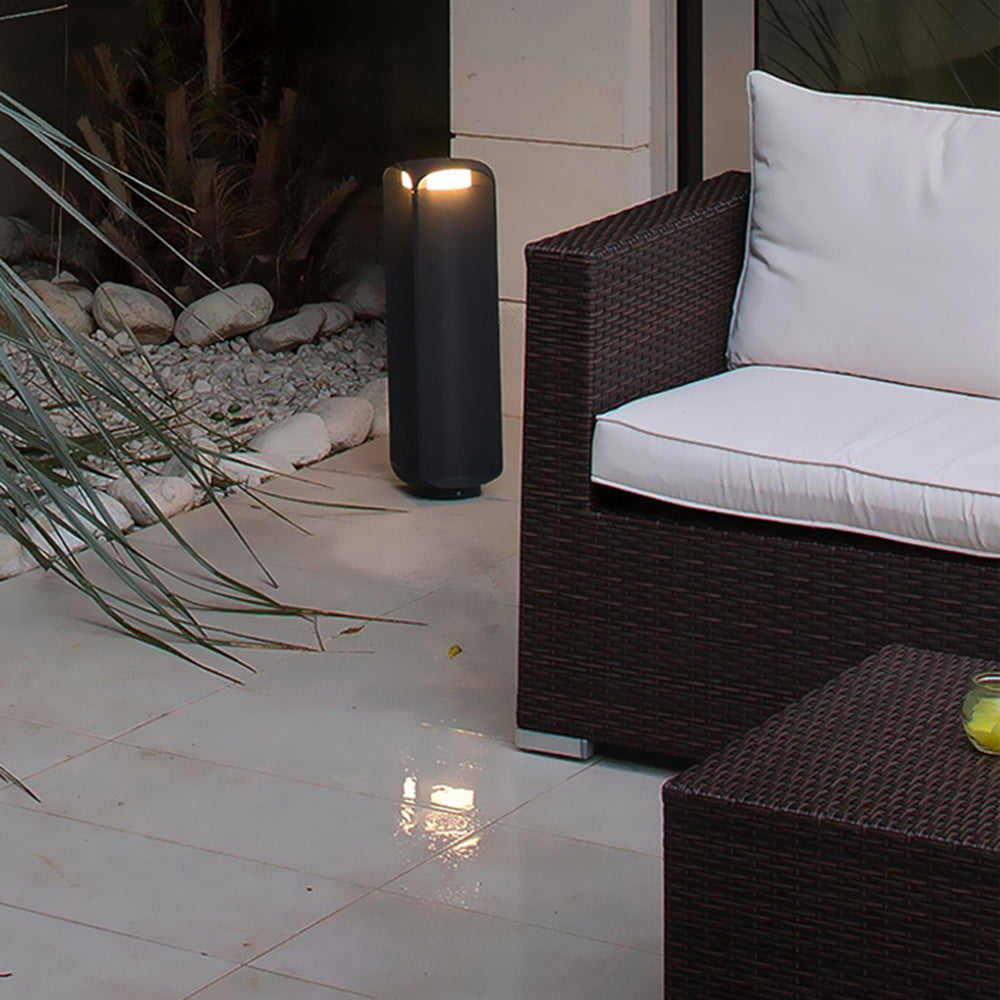 Pena Outdoor Floor Lamp illuminating a modern patio setting