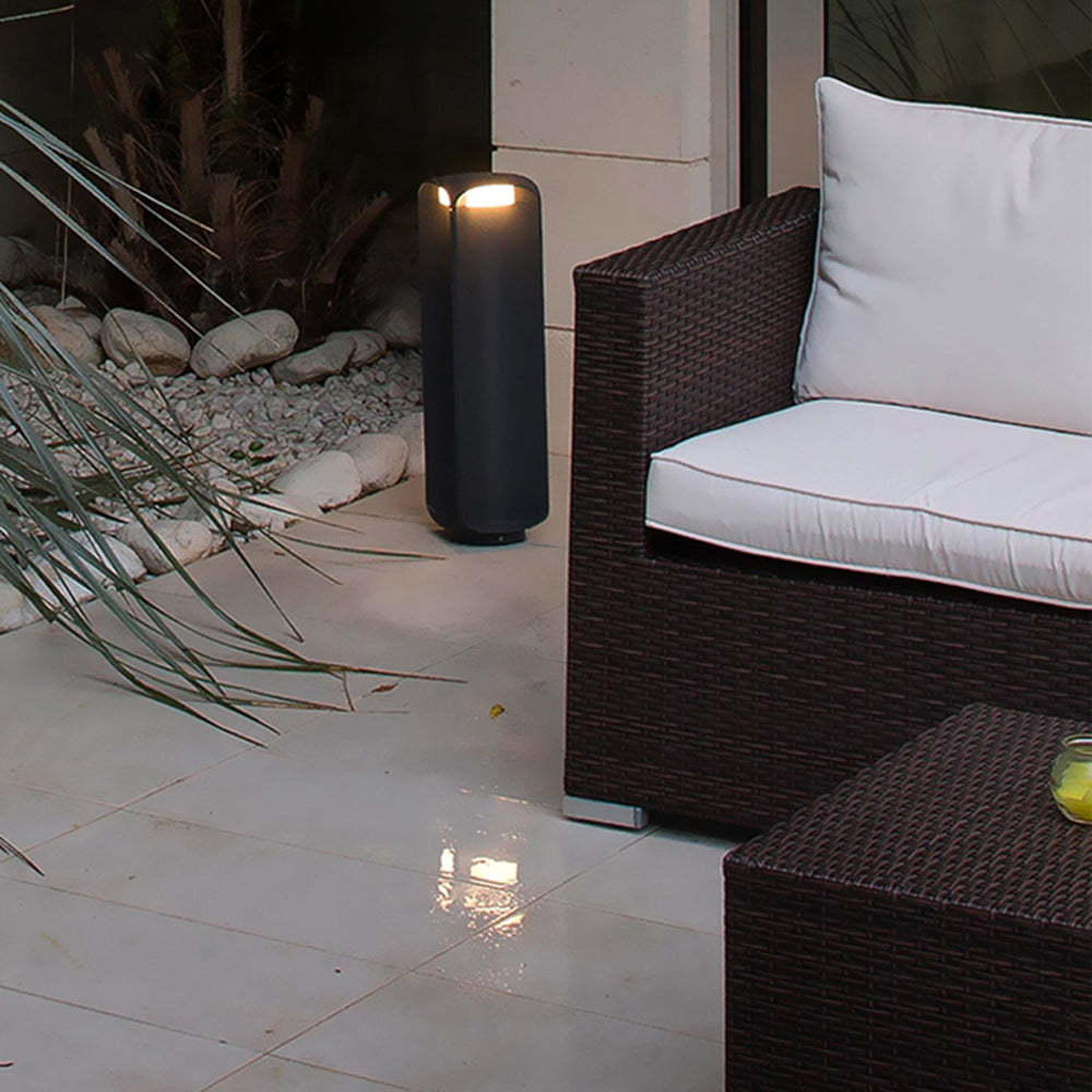 Pena Outdoor Floor Lamp illuminating a modern patio setting