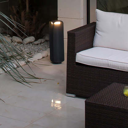 Pena Outdoor Floor Lamp illuminating a modern patio setting