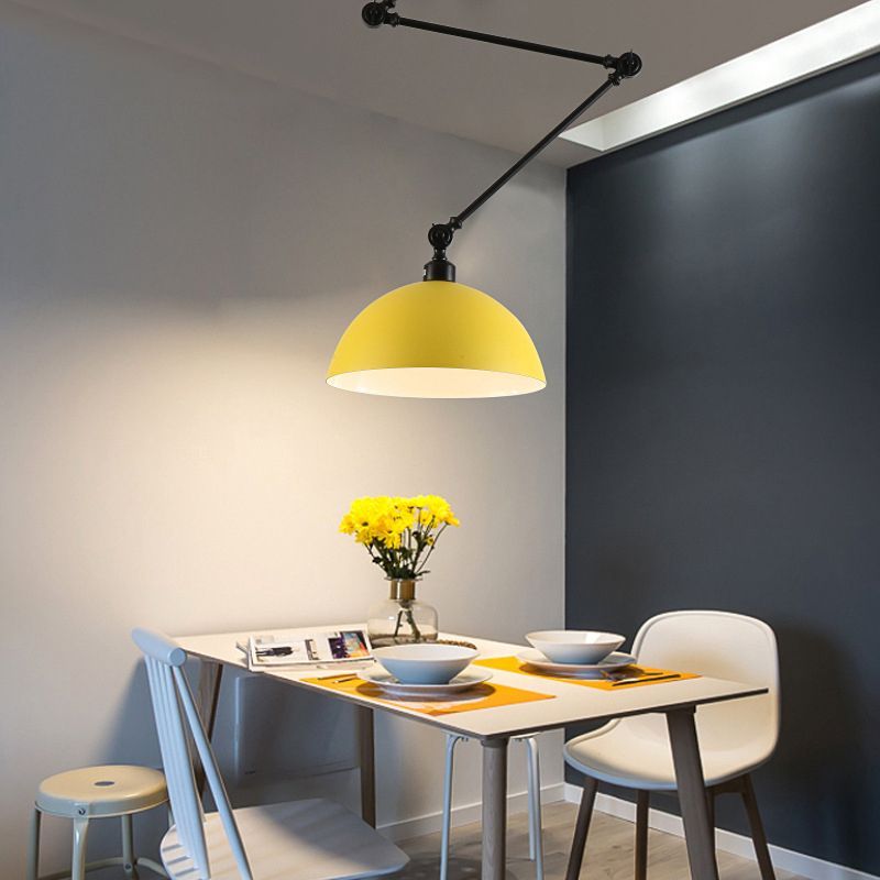 Yellow Minori Pendant Light over a dining table setting