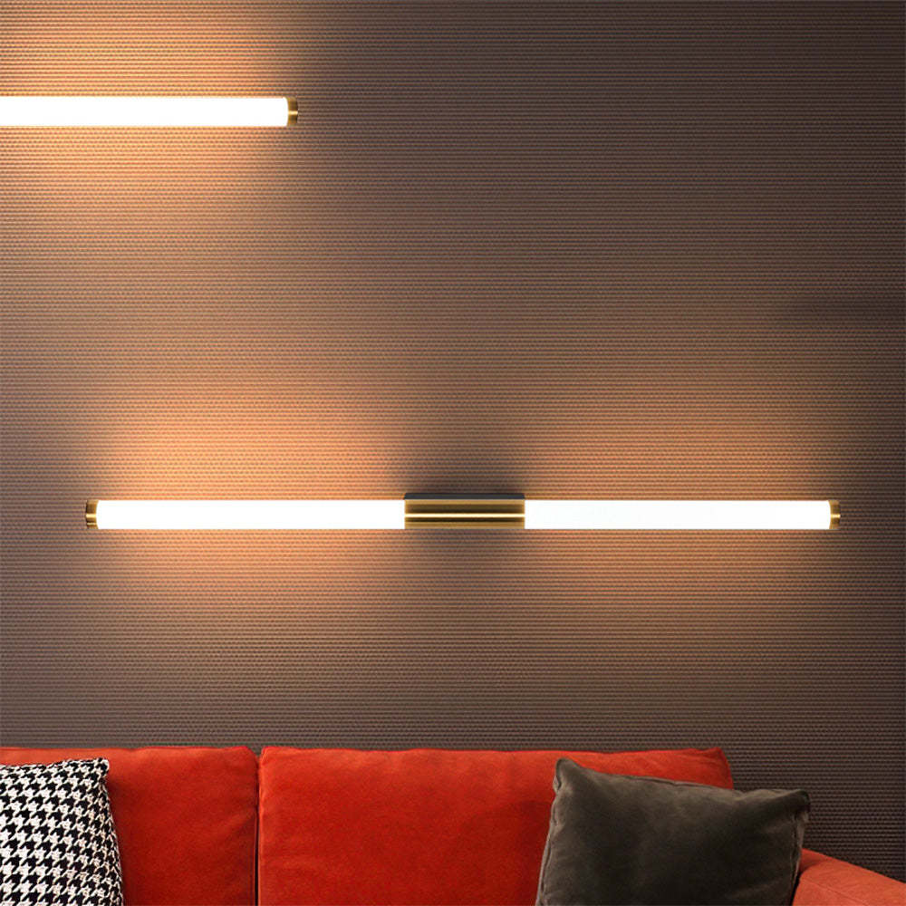 Leigh modern copper wall lamp above red couch, Las Sola lighting. Leigh Modern Linear Copper Mirror Front Wall Lamp