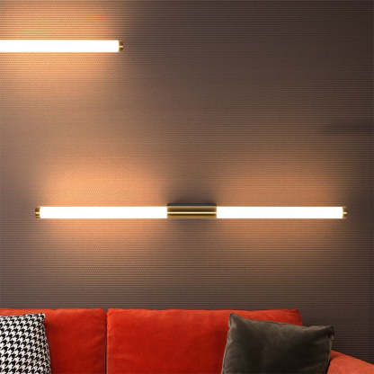 Leigh modern copper wall lamp above red couch, Las Sola lighting. Leigh Modern Linear Copper Mirror Front Wall Lamp