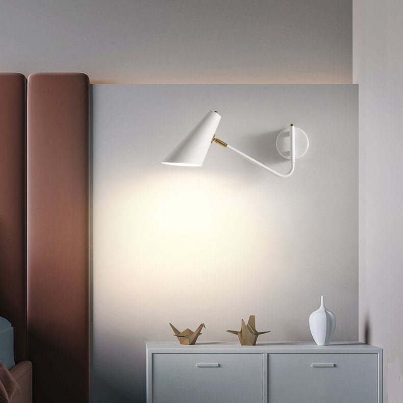 White Brady LED wall lamp in bedroom. Modern lighting.