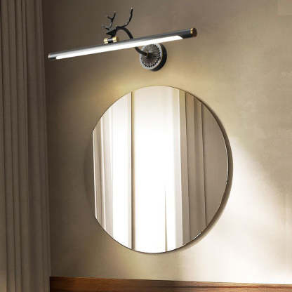 Brass staghorn vanity light. Modern wall lamp above mirror.
