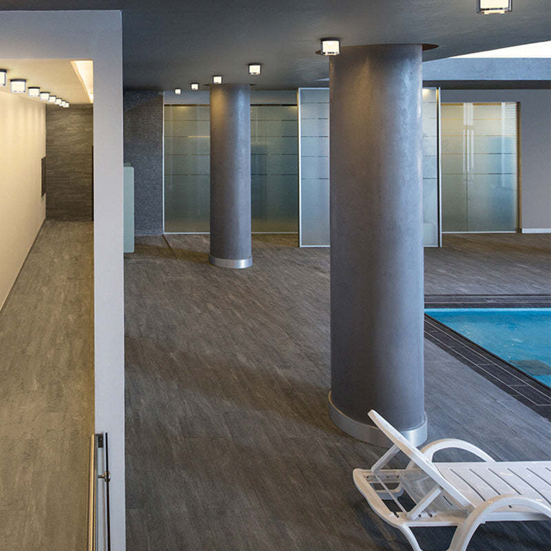Modern interior with contemporary lighting, swimming pool view