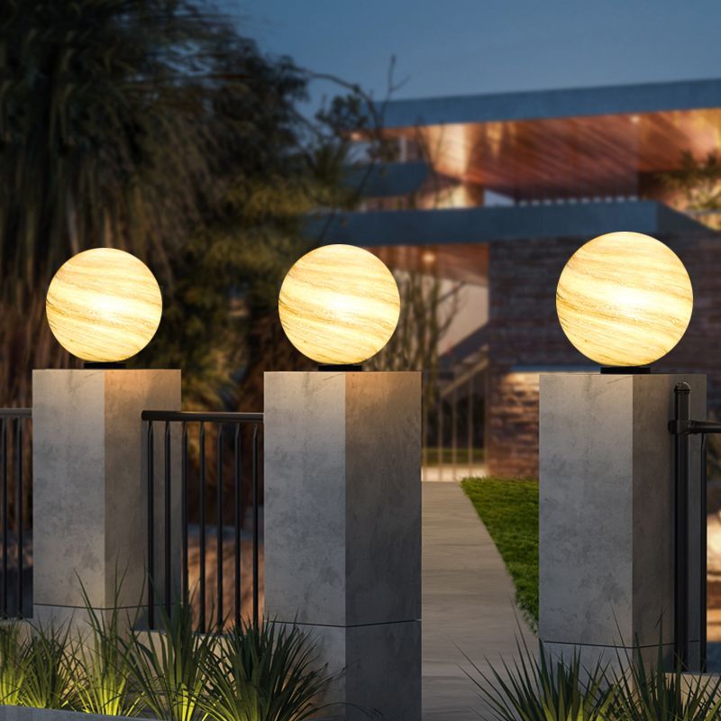 Elif Moon Globe lights on fence pillars, modern outdoor lighting