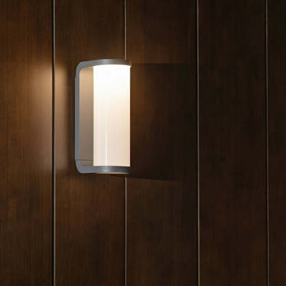 Las Sola Orr modern metal outdoor wall lamp on wood panel.