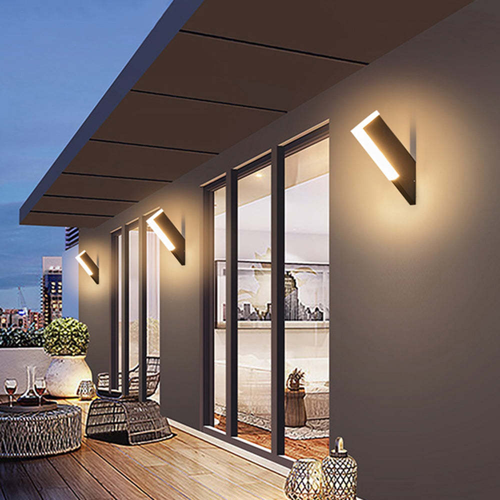 Modern geometric outdoor wall lamp illuminating a balcony