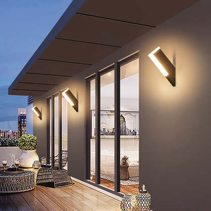 Modern geometric outdoor wall lamp illuminating a balcony