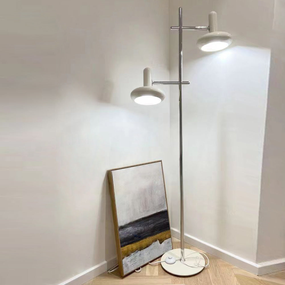 Minimalist Carins Floor Lamp illuminating a corner with artwork