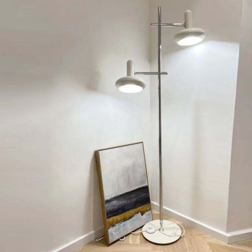 Minimalist Carins Floor Lamp illuminating a corner with artwork