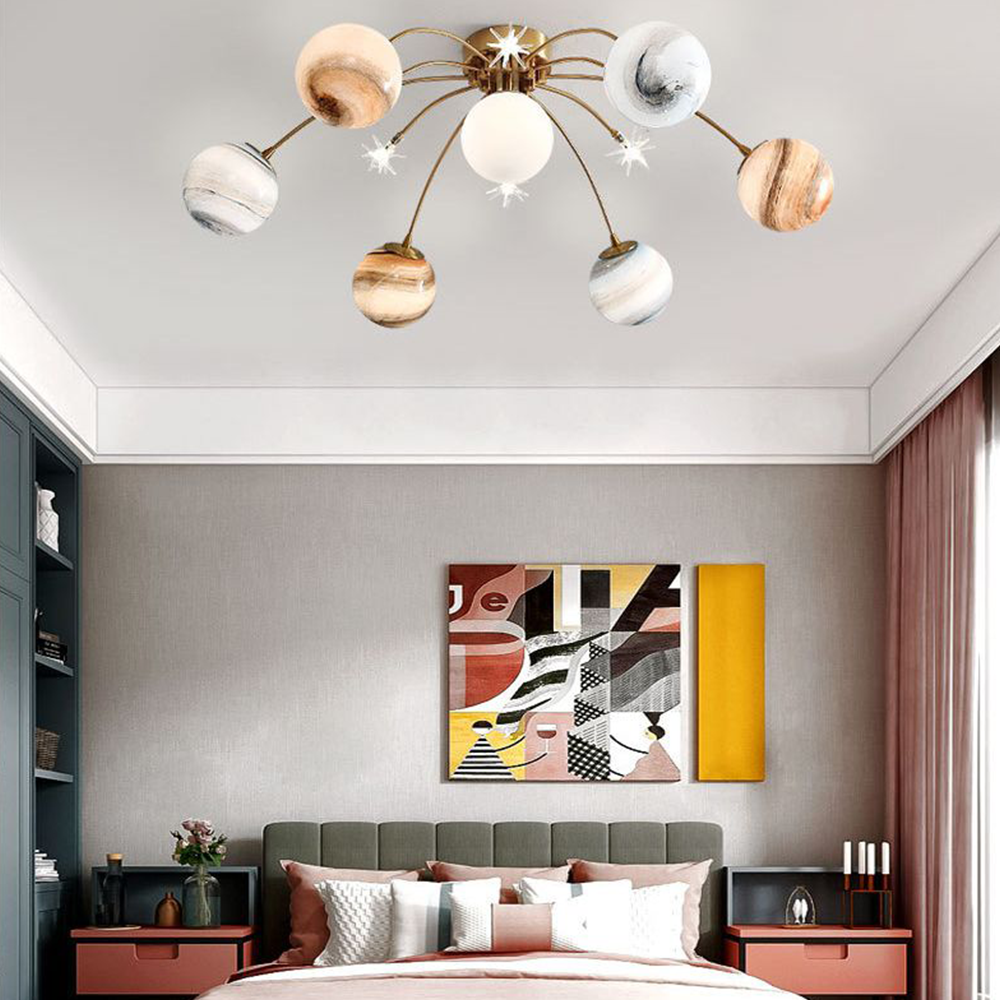 Elif planet ceiling light in bedroom setting.