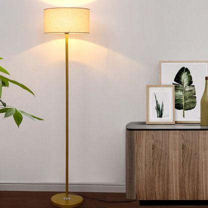 Gold Eryn Cylinder Floor Lamp in Bedroom