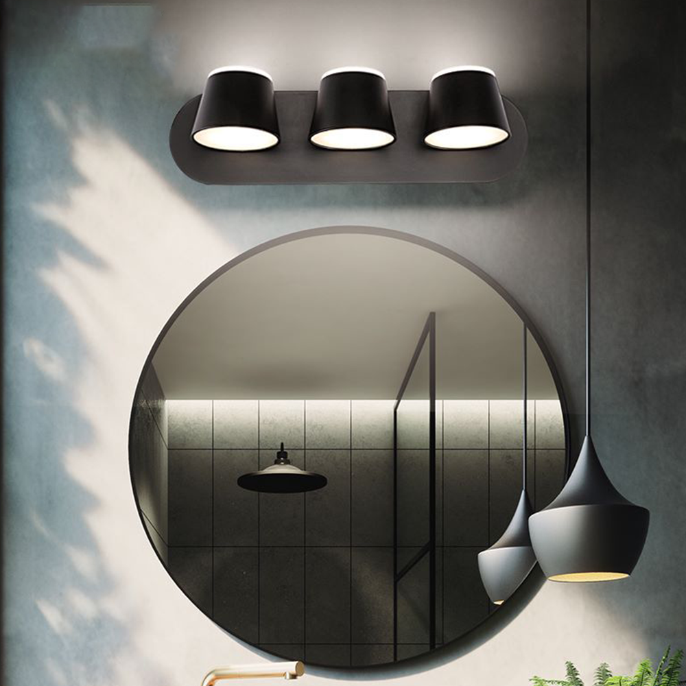 Modern bathroom with black wall lamps and round mirror
