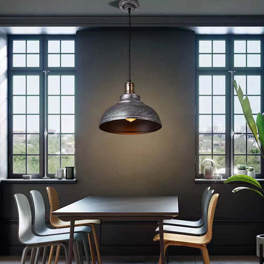 Alessio distressed metal pendant light in dining room.