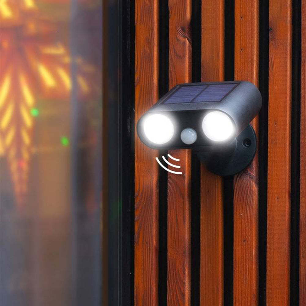 Orr Modern Solar Outdoor Spotlight on wood fence.
