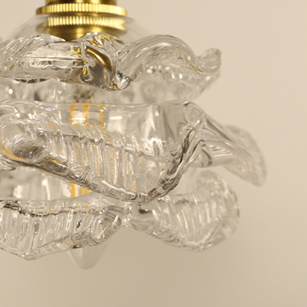 Close-up of clear glass Hailie pendant light fixture, bedroom lighting