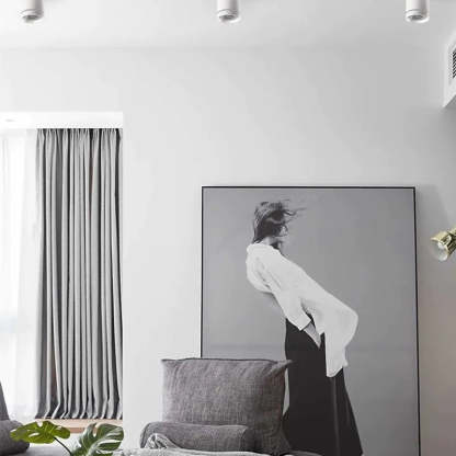 Modern bedroom with Freja ceiling lights and art