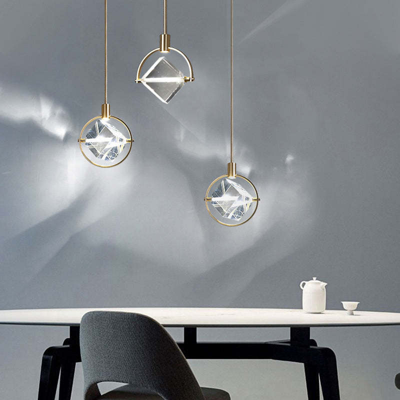 Modern crystal pendant lights over dining table