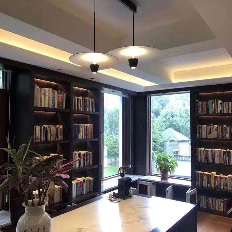 Carins Nordic pendant lights illuminate a home office.