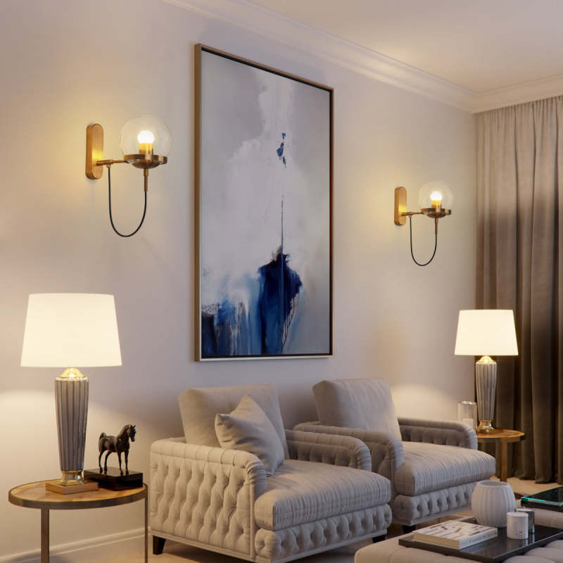 Alessio bronze glass globe wall lighting in living room.