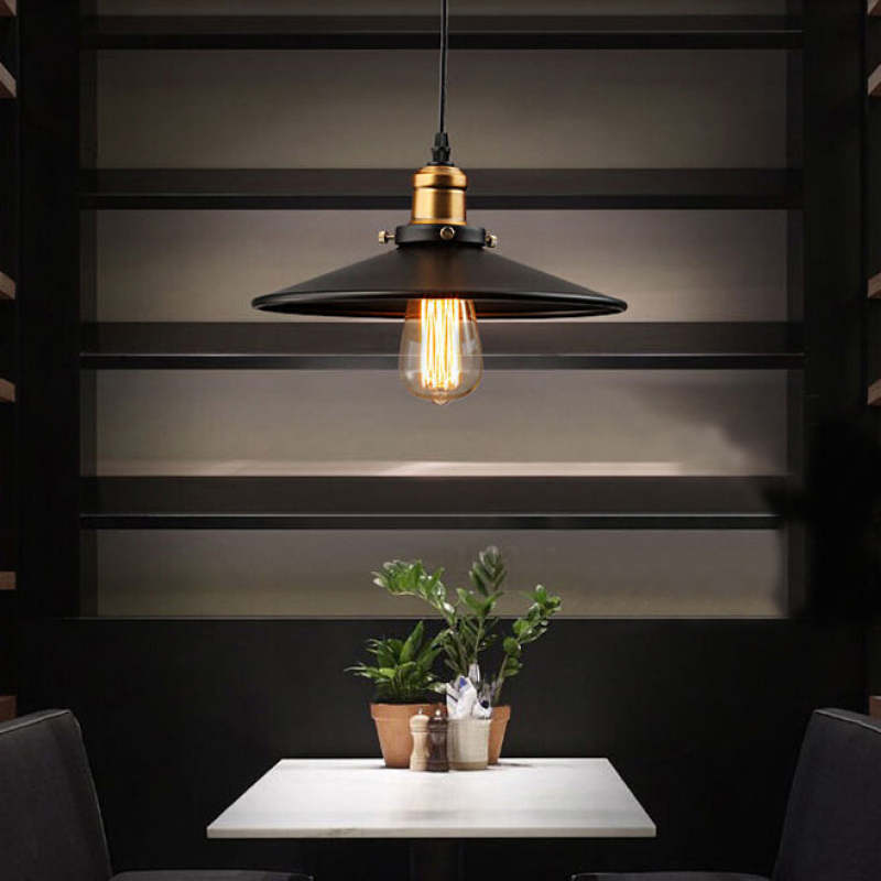 Modern industrial pendant light, black and gold metal finish.